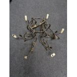 A cast metal six branch light fitting