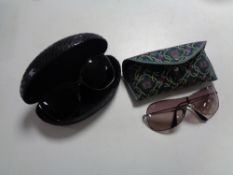 A set of cased lady's sunglasses - Rayban and Guess