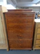 A 19th century mahogany seven drawer chest on bun feet