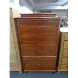 A 19th century mahogany seven drawer chest on bun feet