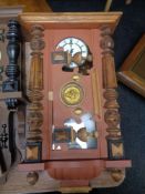 An early 20th century Junghans eight day wall clock in painted case