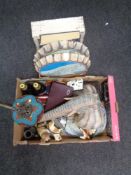 Two boxes of metal bottle cap wall hangings, dog figures, cameras,