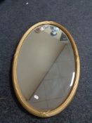 An Edwardian gilt framed oval mirror