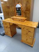 A pine twin pedestal dressing table