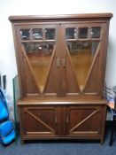 An Edwardian oak double door bookcase