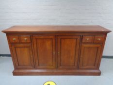 A good quality four door sideboard fitted four drawers