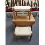 A blonde oak drop leaf coffee table and two dressing table stools