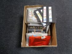 A box of loose stamps and Royal Mail postcards