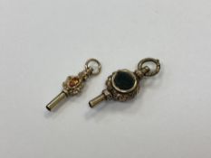 Two antique yellow metal watch keys (2)