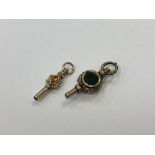 Two antique yellow metal watch keys (2)