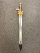 A gilt handled ornamental short sword