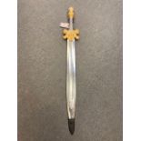 A gilt handled ornamental short sword