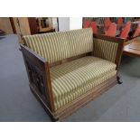 A late 19th century carved oak framed hall settee