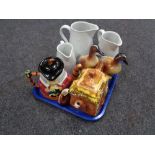 A tray of three Royal Worcester graduated jugs, Price Brothers teapot, character jug teapot,