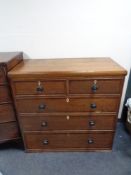 A Victorian oak five drawer chest