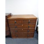 A Victorian oak five drawer chest