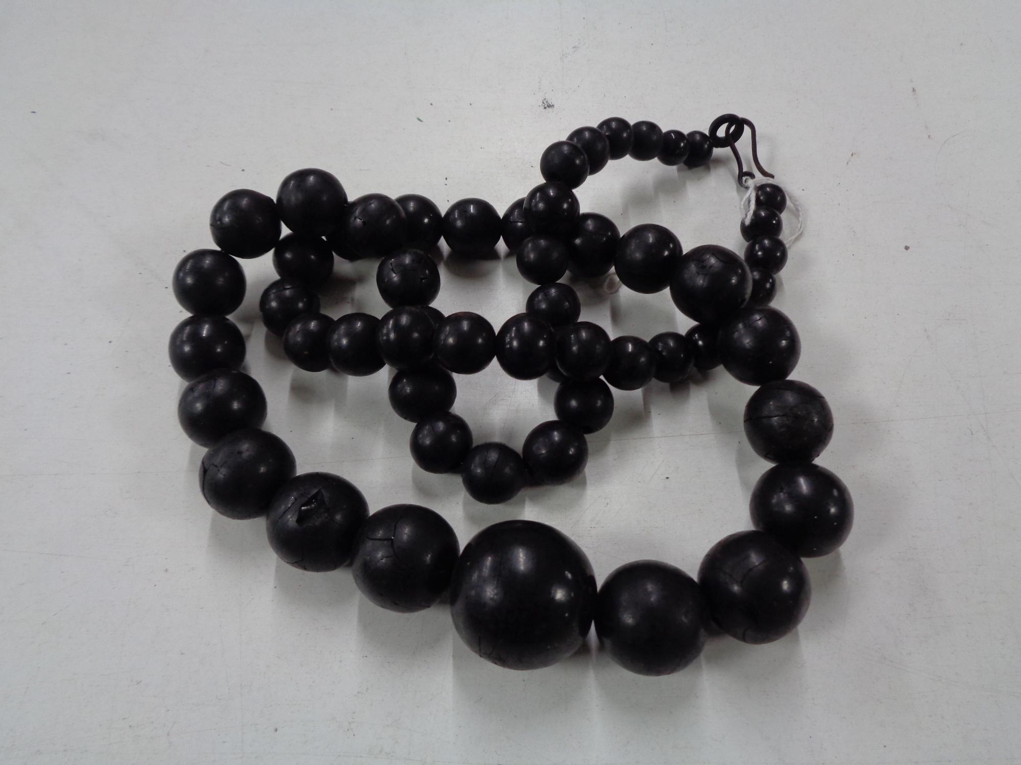 A Whitby Jet beaded necklace CONDITION REPORT: 90cm long. Clasp a/f.