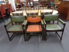 Three 20th century vinyl upholstered armchairs