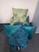 Two boxes of six turquoise cushions and a throw