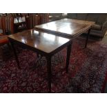 A mid 20th century walnut veneered extending dining table and extending coffee table