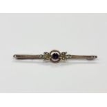 A 9ct gold amethyst and seed pearl bar brooch CONDITION REPORT: 2.