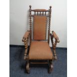 An oak American style rocking chair