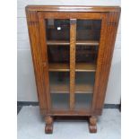A 1930's oak glazed door bookcase CONDITION REPORT: 76cm wide by 37cm deep by 141cm
