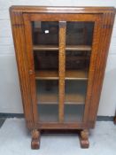 A 1930's oak glazed door bookcase CONDITION REPORT: 76cm wide by 37cm deep by 141cm