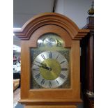 An oak cased longcase clock with pendulum and weights