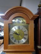 An oak cased longcase clock with pendulum and weights