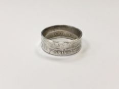 A large 1915 half crown ring,