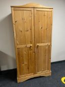 A pine double door wardrobe