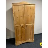 A pine double door wardrobe