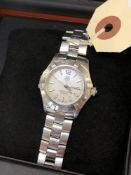 A TAG Heuer lady's wrist watch, model MX 7114 SS Aquaracer BW, stainless steel bracelet,