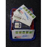A tray of golf balls, signed gold ball, first day covers relating to golf,