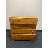 A pine four drawer chest with knob handles