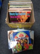 A box of vinyl LP records : world music, Nat King Cole,