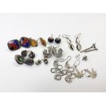 Twelve various pairs of silver earrings