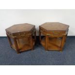 A pair of hexagonal two tier lamp tables with brass mounts
