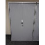 A J G Group metal shutter door stationery cabinet with keys,