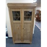 An early 20th century oak double door bookcase