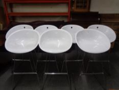 Seven Italian Pedrali white high bar stools on metal legs