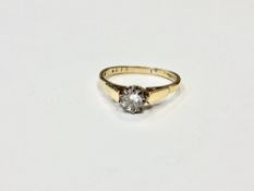 An 18ct gold solitaire diamond ring, the brilliant cut stone weighing approximately 0.