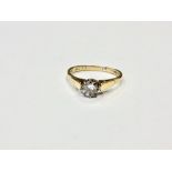 An 18ct gold solitaire diamond ring, the brilliant cut stone weighing approximately 0.