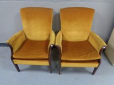 A pair of mid 20th century fireside chairs