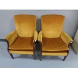 A pair of mid 20th century fireside chairs
