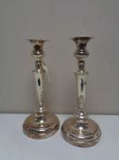 A pair of antique silver on copper candlesticks, height 29.5 cm.