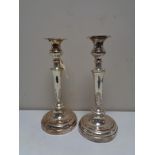 A pair of antique silver on copper candlesticks, height 29.5 cm.