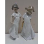 Two Nao figures - Girl in night dress no. 1109 1110.