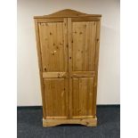 A pine double door wardrobe